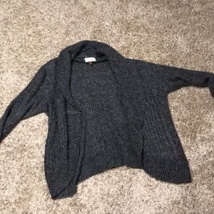 A charcoal grey sweater